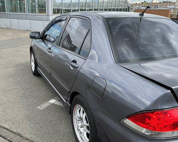Сірий Міцубісі Lancer, об'ємом двигуна 1.6 л та пробігом 260 тис. км за 4998 $, фото 8 на Automoto.ua