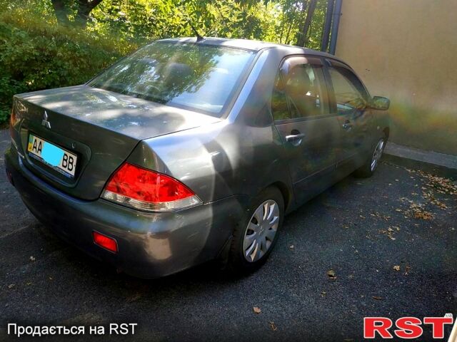 Серый Мицубиси Лансер, объемом двигателя 1.6 л и пробегом 177 тыс. км за 4000 $, фото 1 на Automoto.ua