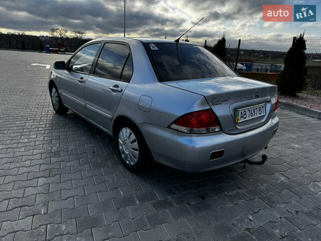 Сірий Міцубісі Lancer, об'ємом двигуна 1.58 л та пробігом 333 тис. км за 2999 $, фото 6 на Automoto.ua