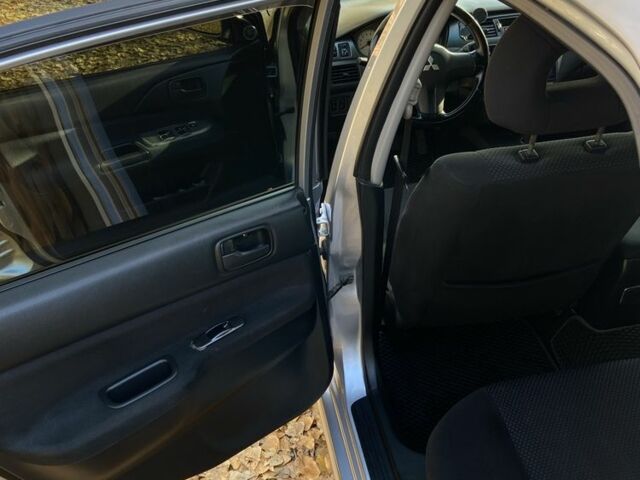 Серый Мицубиси Лансер, объемом двигателя 1.6 л и пробегом 204 тыс. км за 3999 $, фото 8 на Automoto.ua