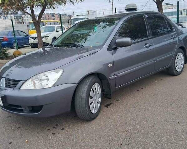 Сірий Міцубісі Lancer, об'ємом двигуна 1.6 л та пробігом 229 тис. км за 4900 $, фото 24 на Automoto.ua