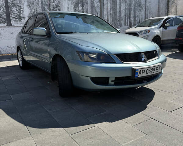 Серый Мицубиси Лансер, объемом двигателя 1.58 л и пробегом 280 тыс. км за 3897 $, фото 1 на Automoto.ua