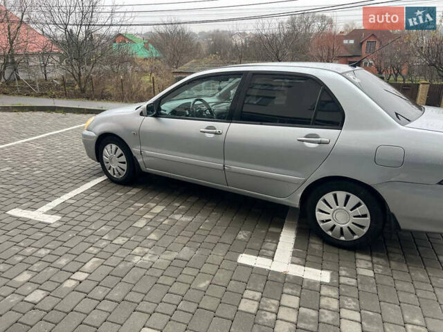 Сірий Міцубісі Lancer, об'ємом двигуна 1.58 л та пробігом 333 тис. км за 2999 $, фото 8 на Automoto.ua