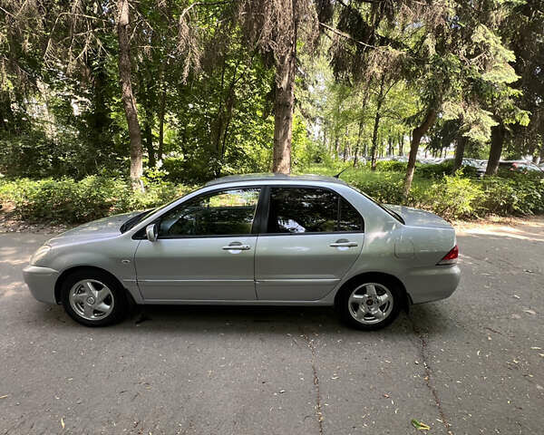 Сірий Міцубісі Lancer, об'ємом двигуна 1.6 л та пробігом 331 тис. км за 3100 $, фото 5 на Automoto.ua