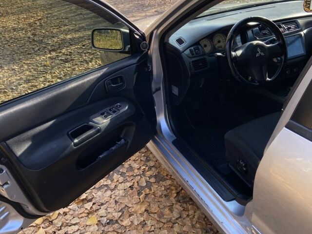 Серый Мицубиси Лансер, объемом двигателя 1.6 л и пробегом 204 тыс. км за 3999 $, фото 7 на Automoto.ua