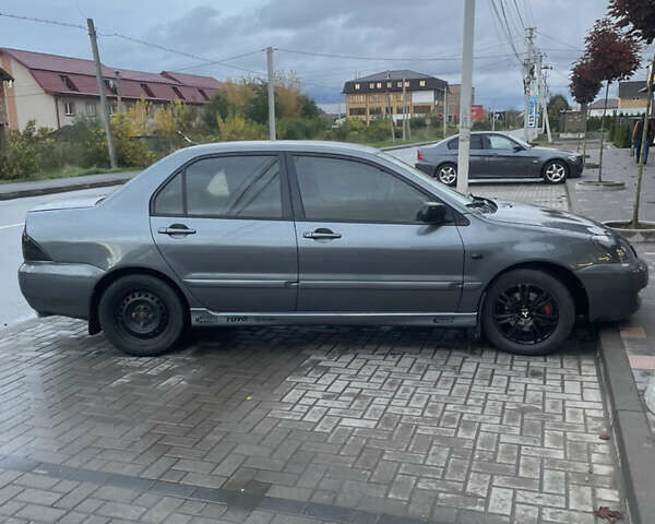 Сірий Міцубісі Lancer, об'ємом двигуна 1.6 л та пробігом 244 тис. км за 2999 $, фото 3 на Automoto.ua