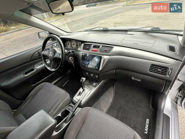 Серый Мицубиси Лансер, объемом двигателя 1.58 л и пробегом 183 тыс. км за 4800 $, фото 21 на Automoto.ua