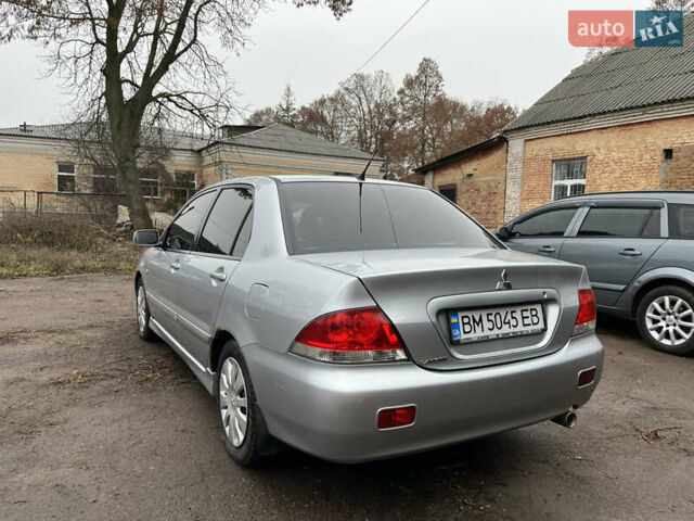 Сірий Міцубісі Lancer, об'ємом двигуна 1.58 л та пробігом 308 тис. км за 3700 $, фото 4 на Automoto.ua