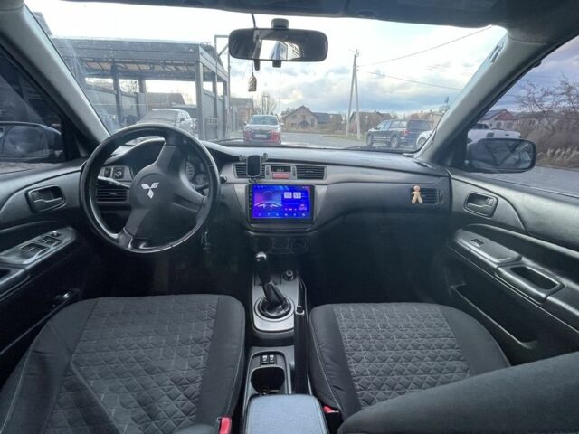 Серый Мицубиси Лансер, объемом двигателя 1.6 л и пробегом 213 тыс. км за 4450 $, фото 7 на Automoto.ua