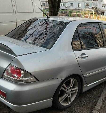 Серый Мицубиси Лансер, объемом двигателя 2 л и пробегом 284 тыс. км за 4100 $, фото 6 на Automoto.ua