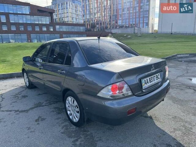 Сірий Міцубісі Lancer, об'ємом двигуна 1.58 л та пробігом 276 тис. км за 3650 $, фото 8 на Automoto.ua