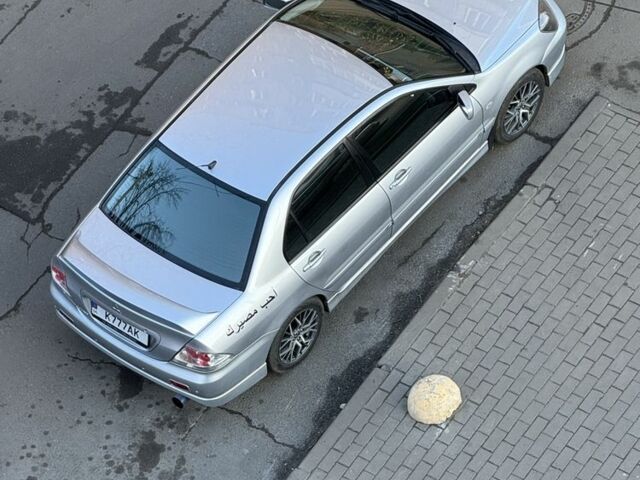 Серый Мицубиси Лансер, объемом двигателя 2 л и пробегом 256 тыс. км за 7000 $, фото 11 на Automoto.ua