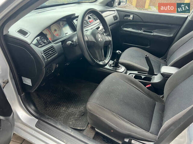 Сірий Міцубісі Lancer, об'ємом двигуна 1.58 л та пробігом 333 тис. км за 2450 $, фото 17 на Automoto.ua