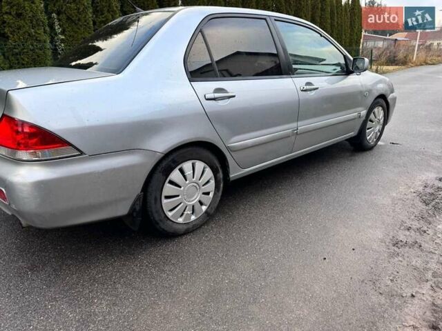 Сірий Міцубісі Lancer, об'ємом двигуна 1.58 л та пробігом 333 тис. км за 2750 $, фото 7 на Automoto.ua