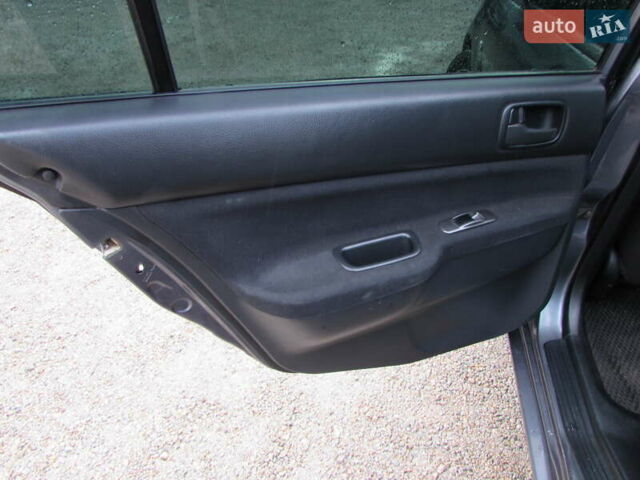 Серый Мицубиси Лансер, объемом двигателя 1.58 л и пробегом 300 тыс. км за 3600 $, фото 8 на Automoto.ua