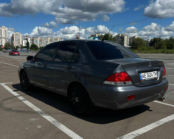 Сірий Міцубісі Lancer, об'ємом двигуна 1.6 л та пробігом 223 тис. км за 4500 $, фото 3 на Automoto.ua