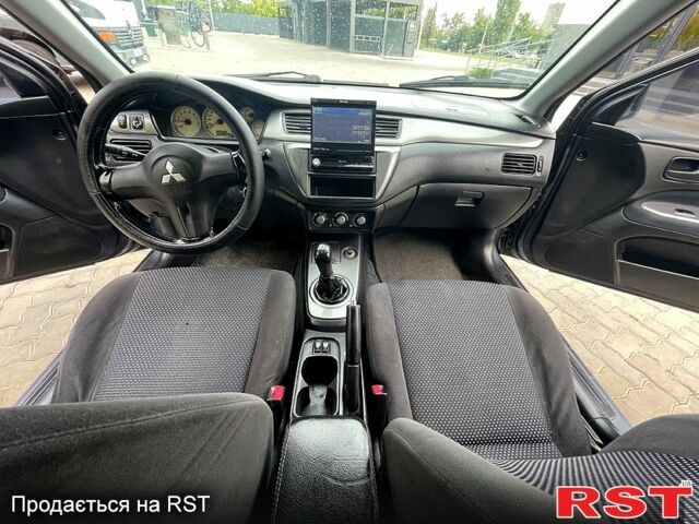 Сірий Міцубісі Lancer, об'ємом двигуна 1.6 л та пробігом 162 тис. км за 4650 $, фото 7 на Automoto.ua