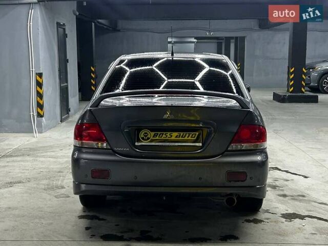 Серый Мицубиси Лансер, объемом двигателя 1.58 л и пробегом 300 тыс. км за 4600 $, фото 4 на Automoto.ua