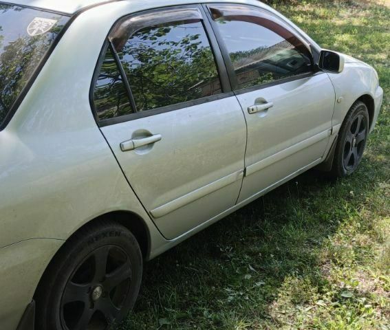 Сірий Міцубісі Lancer, об'ємом двигуна 1.6 л та пробігом 258 тис. км за 4100 $, фото 7 на Automoto.ua