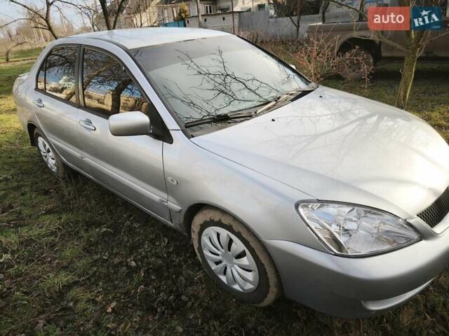 Серый Мицубиси Лансер, объемом двигателя 1.6 л и пробегом 234 тыс. км за 4300 $, фото 1 на Automoto.ua