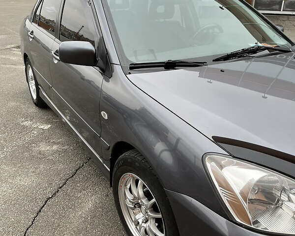 Сірий Міцубісі Lancer, об'ємом двигуна 1.6 л та пробігом 260 тис. км за 4998 $, фото 32 на Automoto.ua