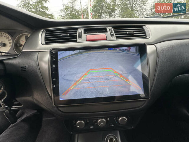 Серый Мицубиси Лансер, объемом двигателя 1.58 л и пробегом 183 тыс. км за 4800 $, фото 30 на Automoto.ua