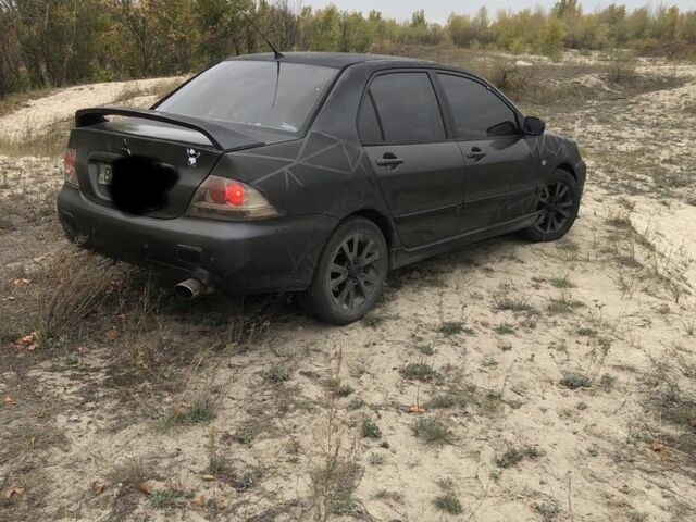 Міцубісі Lancer 2006 у Синельниковом на Automoto.ua Сірий Міцубісі Lancer, об'ємом двигуна 2 л та пробігом 200 тис. км за 3000 $, фото 2 на Automoto.ua