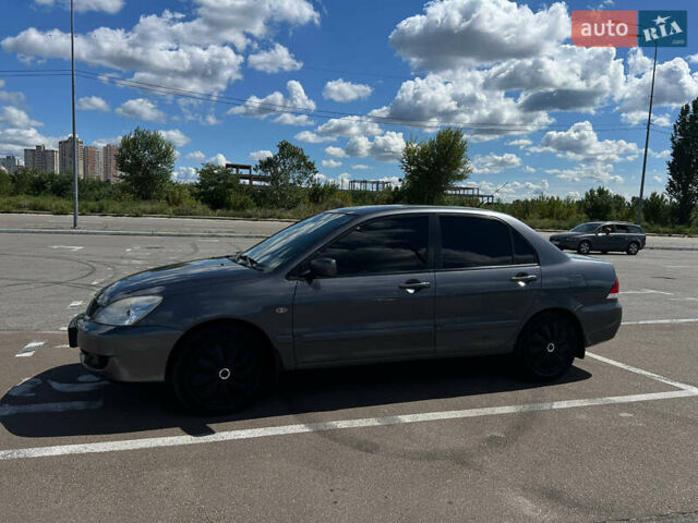 Сірий Міцубісі Lancer, об'ємом двигуна 1.6 л та пробігом 223 тис. км за 4500 $, фото 4 на Automoto.ua