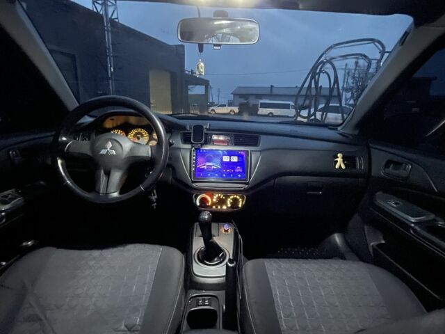 Серый Мицубиси Лансер, объемом двигателя 1.6 л и пробегом 213 тыс. км за 4450 $, фото 5 на Automoto.ua