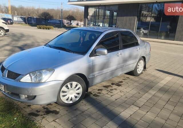 Сірий Міцубісі Lancer, об'ємом двигуна 1.6 л та пробігом 206 тис. км за 3800 $, фото 2 на Automoto.ua
