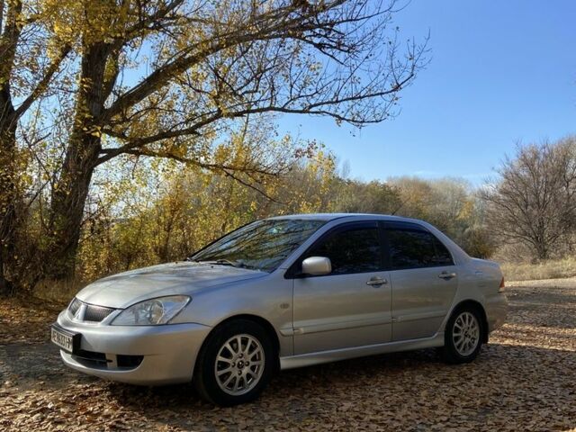 Серый Мицубиси Лансер, объемом двигателя 1.6 л и пробегом 204 тыс. км за 3999 $, фото 6 на Automoto.ua