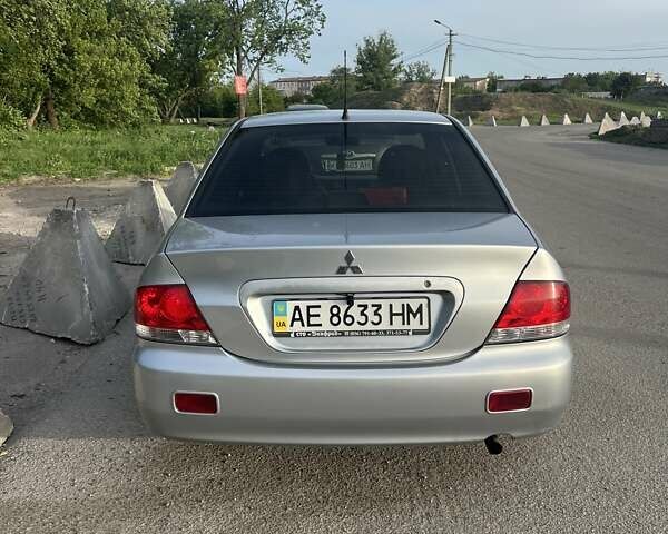 Сірий Міцубісі Lancer, об'ємом двигуна 1.58 л та пробігом 197 тис. км за 3450 $, фото 7 на Automoto.ua