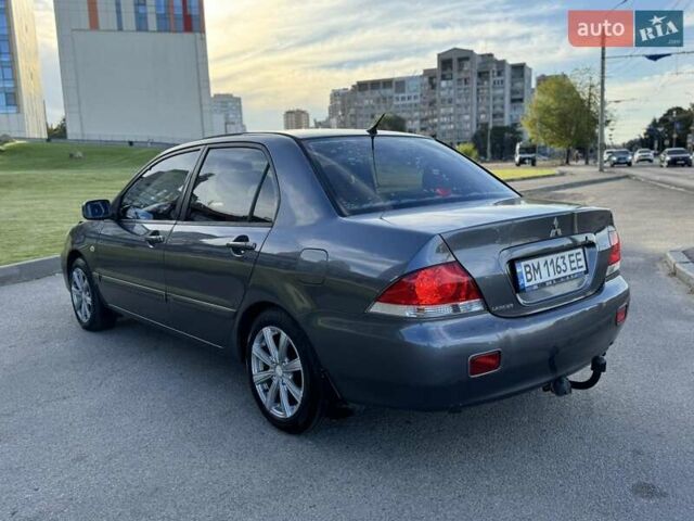 Сірий Міцубісі Lancer, об'ємом двигуна 1.58 л та пробігом 267 тис. км за 3999 $, фото 6 на Automoto.ua