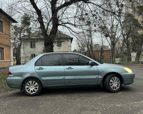 Сірий Міцубісі Lancer, об'ємом двигуна 1.6 л та пробігом 240 тис. км за 3000 $, фото 3 на Automoto.ua