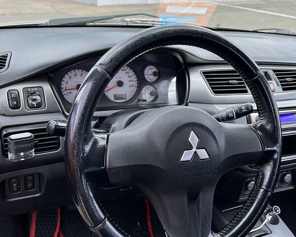 Сірий Міцубісі Lancer, об'ємом двигуна 1.6 л та пробігом 260 тис. км за 4998 $, фото 1 на Automoto.ua