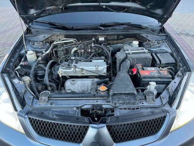 Серый Мицубиси Лансер, объемом двигателя 1.6 л и пробегом 279 тыс. км за 3990 $, фото 7 на Automoto.ua