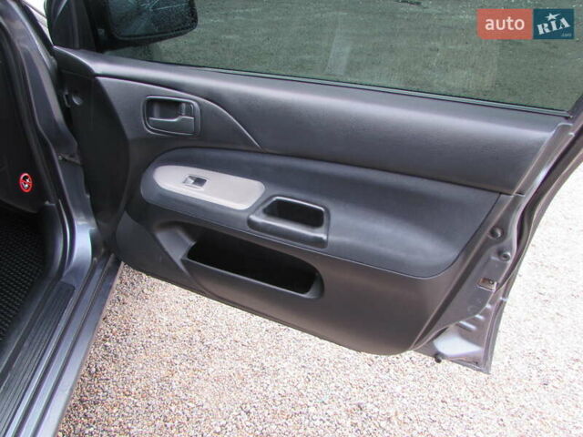 Серый Мицубиси Лансер, объемом двигателя 1.58 л и пробегом 300 тыс. км за 3600 $, фото 15 на Automoto.ua