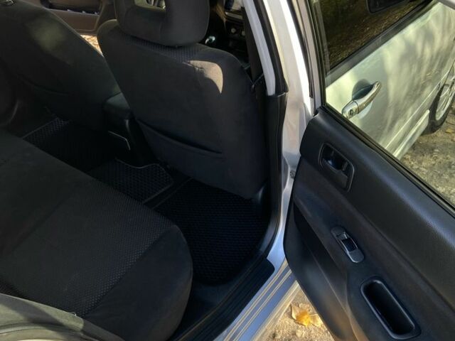 Серый Мицубиси Лансер, объемом двигателя 1.6 л и пробегом 204 тыс. км за 3999 $, фото 11 на Automoto.ua