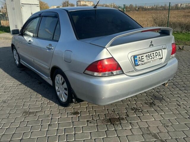 Серый Мицубиси Лансер, объемом двигателя 1.6 л и пробегом 170 тыс. км за 3700 $, фото 2 на Automoto.ua