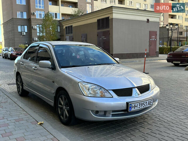 Серый Мицубиси Лансер, объемом двигателя 1.58 л и пробегом 244 тыс. км за 4950 $, фото 4 на Automoto.ua