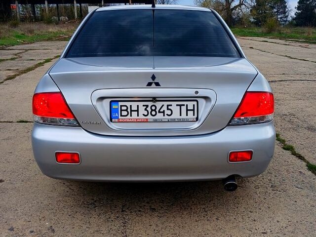 Сірий Міцубісі Lancer, об'ємом двигуна 1.6 л та пробігом 220 тис. км за 5300 $, фото 4 на Automoto.ua