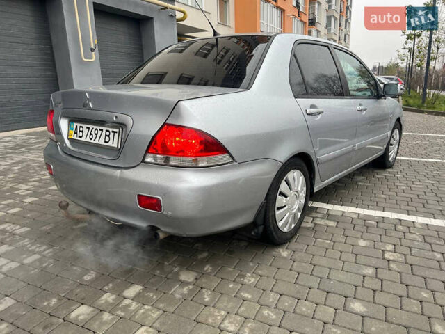 Сірий Міцубісі Lancer, об'ємом двигуна 1.58 л та пробігом 333 тис. км за 2950 $, фото 9 на Automoto.ua