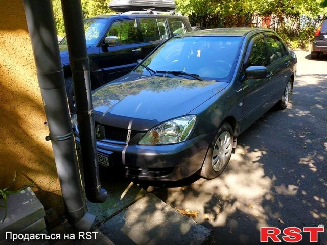 Серый Мицубиси Лансер, объемом двигателя 1.6 л и пробегом 177 тыс. км за 4000 $, фото 8 на Automoto.ua