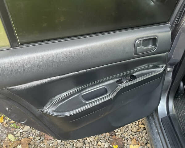 Сірий Міцубісі Lancer, об'ємом двигуна 1.6 л та пробігом 244 тис. км за 2999 $, фото 13 на Automoto.ua
