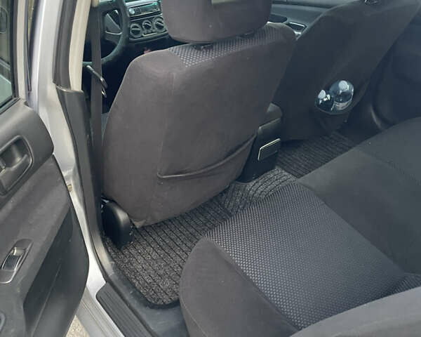 Сірий Міцубісі Lancer, об'ємом двигуна 1.58 л та пробігом 430 тис. км за 2550 $, фото 12 на Automoto.ua