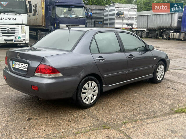 Серый Мицубиси Лансер, объемом двигателя 1.6 л и пробегом 193 тыс. км за 4700 $, фото 5 на Automoto.ua