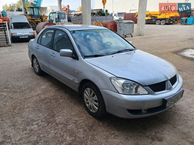 Серый Мицубиси Лансер, объемом двигателя 1.58 л и пробегом 215 тыс. км за 4000 $, фото 1 на Automoto.ua