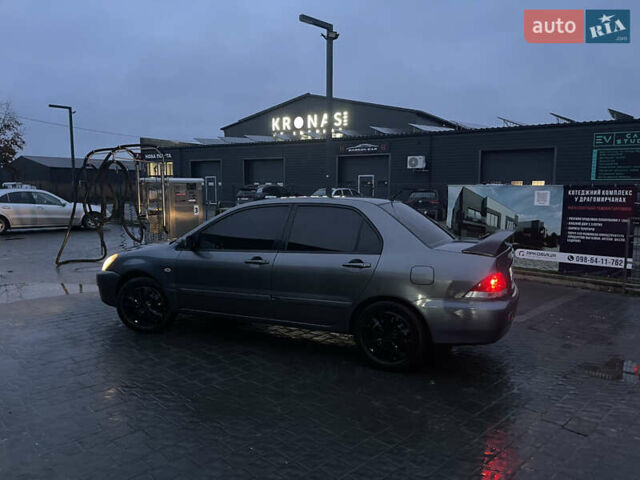 Серый Мицубиси Лансер, объемом двигателя 1.6 л и пробегом 213 тыс. км за 4500 $, фото 4 на Automoto.ua