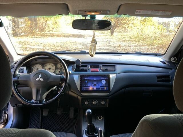 Серый Мицубиси Лансер, объемом двигателя 1.6 л и пробегом 204 тыс. км за 3999 $, фото 14 на Automoto.ua