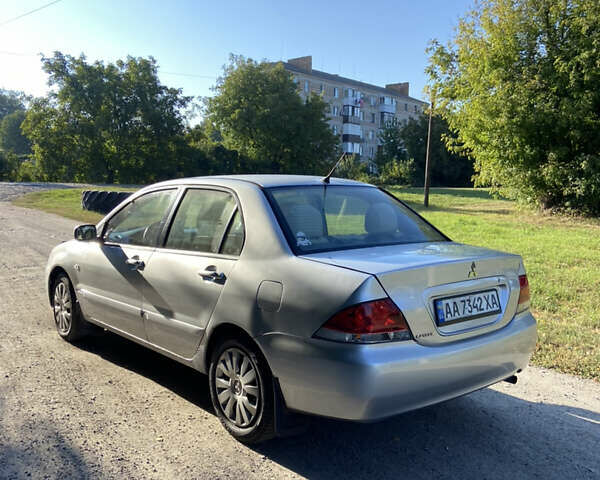 Серый Мицубиси Лансер, объемом двигателя 1.58 л и пробегом 275 тыс. км за 2900 $, фото 6 на Automoto.ua